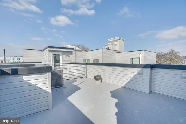 a view of a brick building with many windows