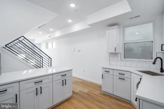 a view of a kitchen with electric appliances
