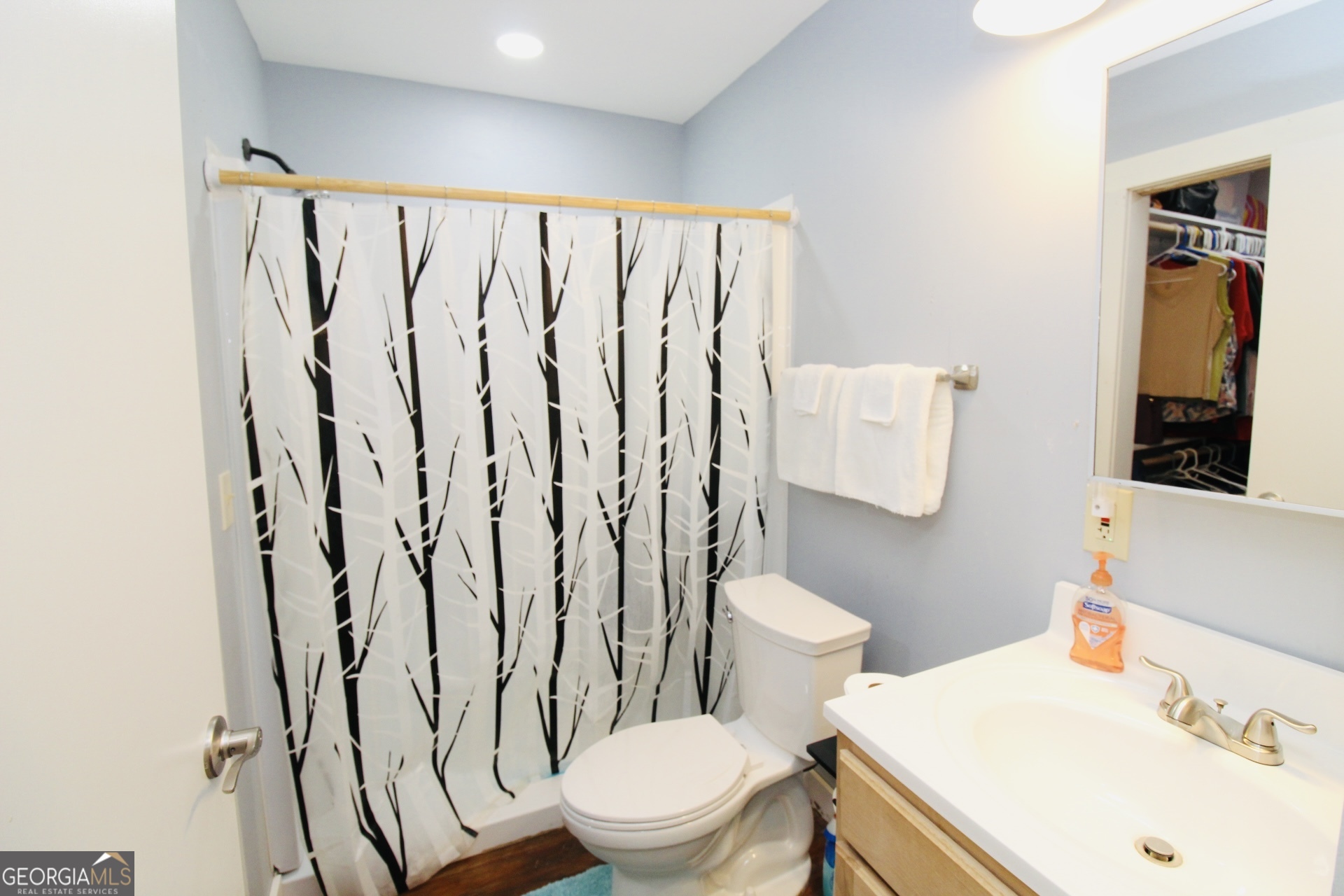 218 6th Avenue Rochelle, GA 31079 - Photo 12 of 22 a white toilet sitting next to a bathroom sink