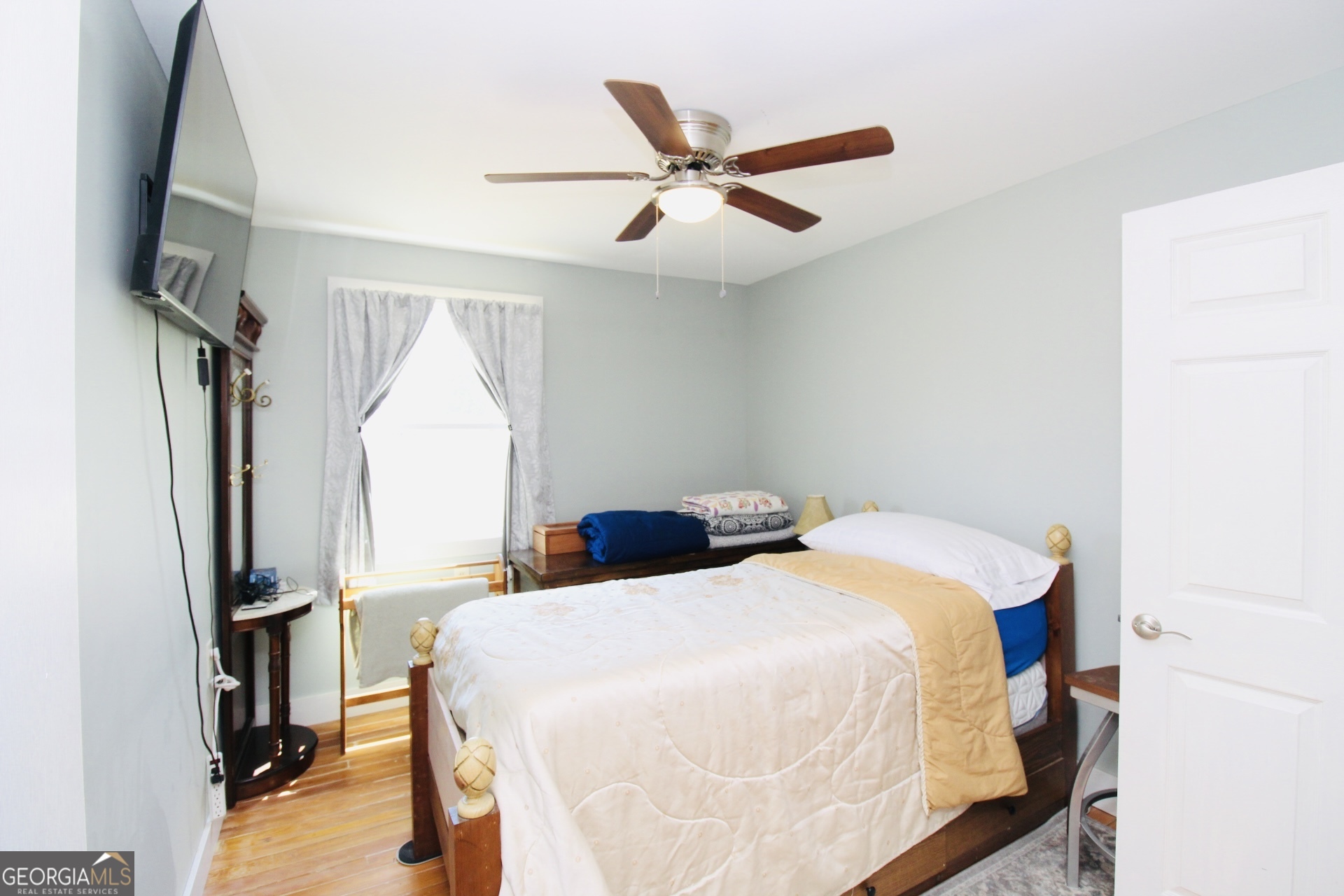 218 6th Avenue Rochelle, GA 31079 - Photo 13 of 22 a bedroom with a bed and a flat screen tv