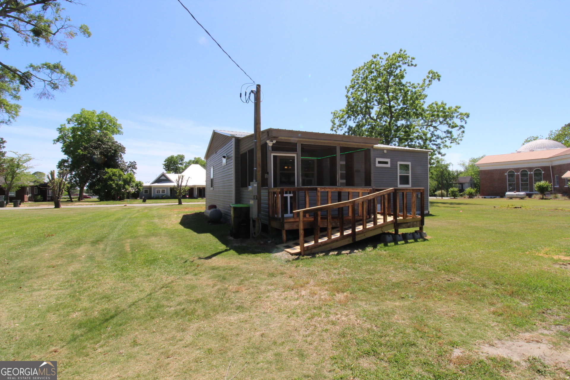218 6th Avenue Rochelle, GA 31079 - Photo 19 of 22 a view of a house with a yard