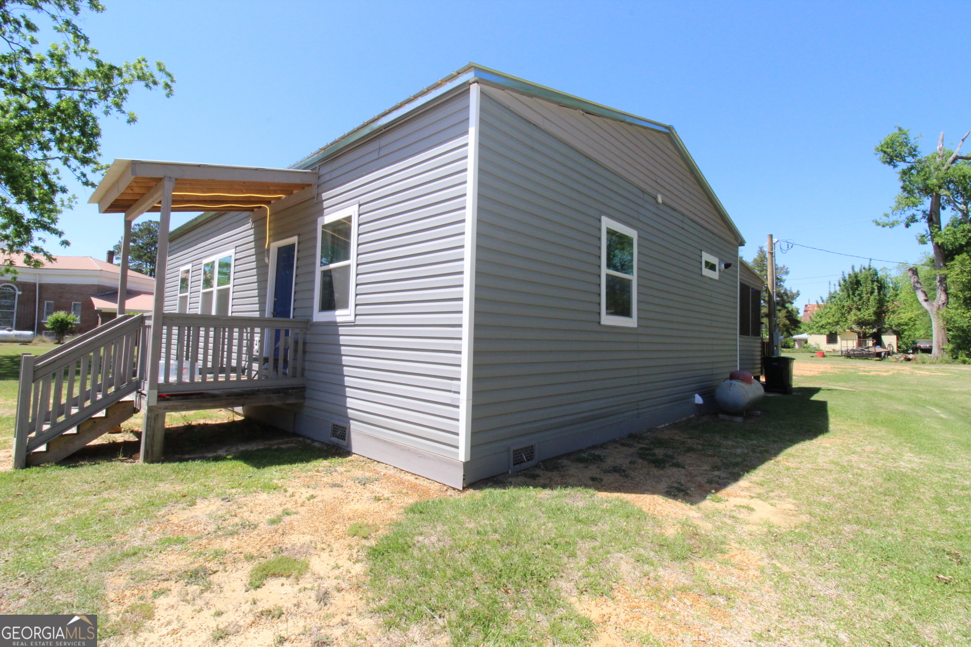 218 6th Avenue Rochelle, GA 31079 - Photo 2 of 22 a view of a house with a yard
