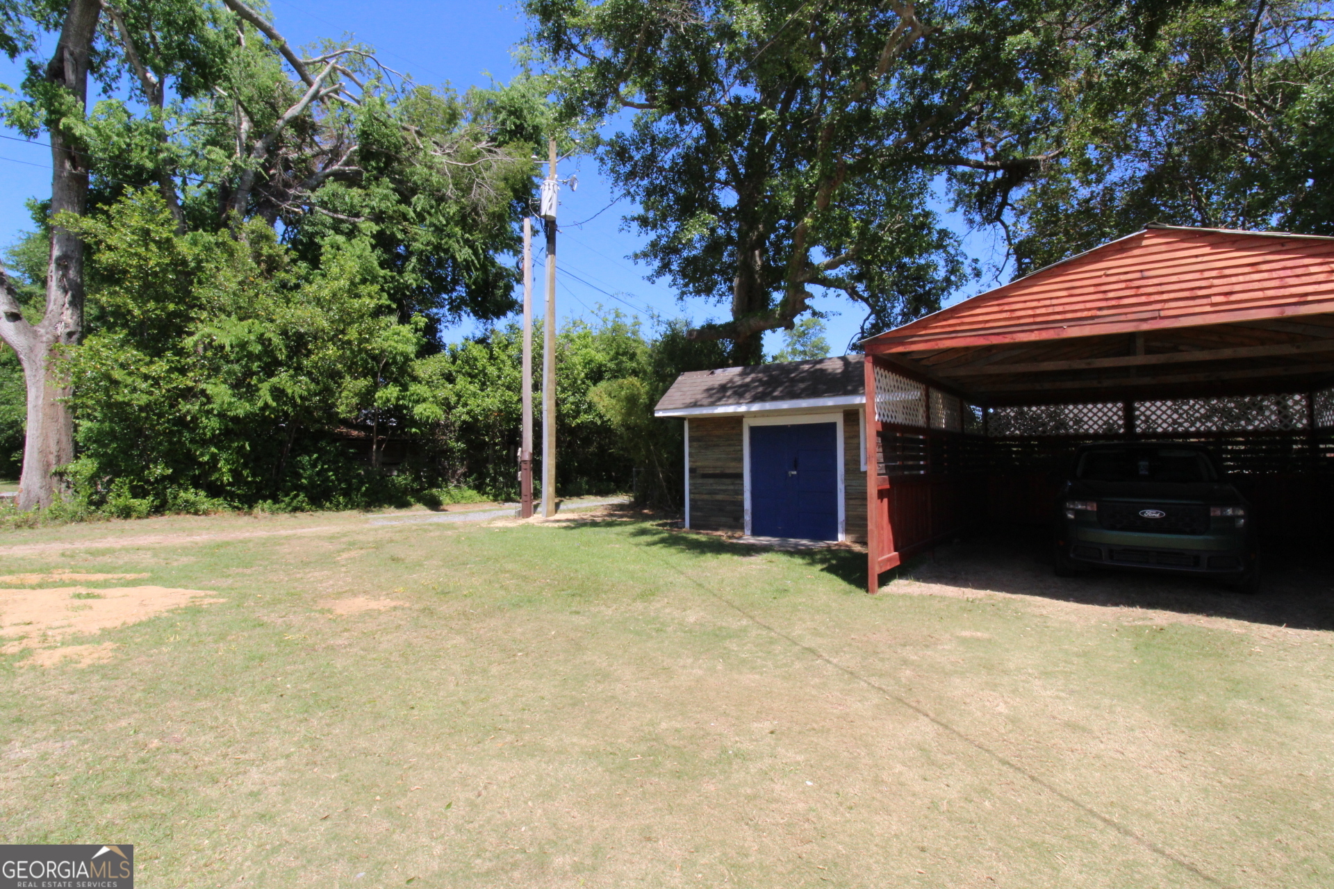 218 6th Avenue Rochelle, GA 31079 - Photo 22 of 22 a view of a house with backyard and sitting area