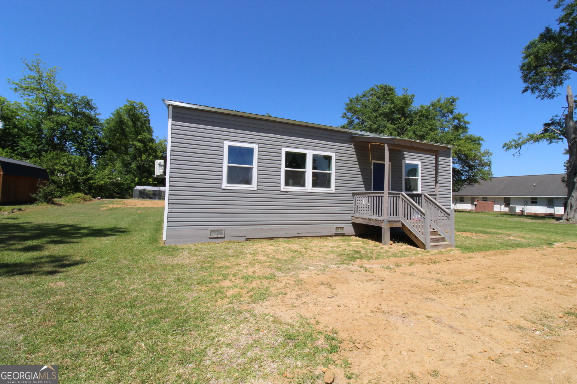218 6th Avenue Rochelle, GA 31079 - Photo 3 of 22 a view of a house with backyard and sitting area