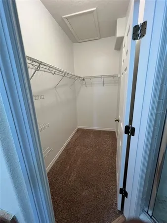 an empty room with windows and entrance