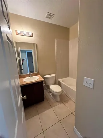 an empty room with large windows