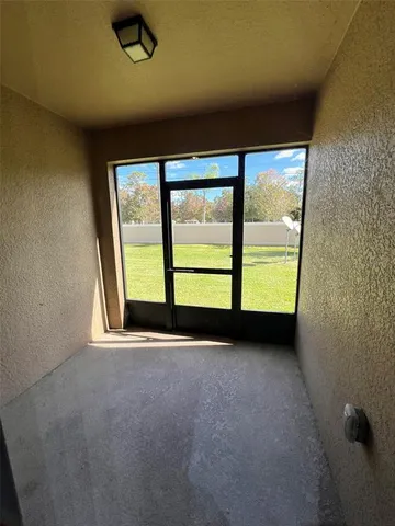 a view of a house with a yard from a balcony