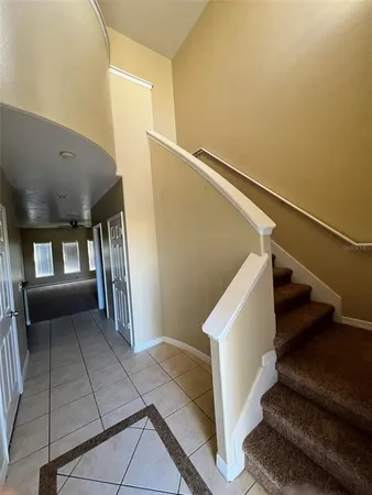 a view of a kitchen with a sink stainless steel appliances and cabinets