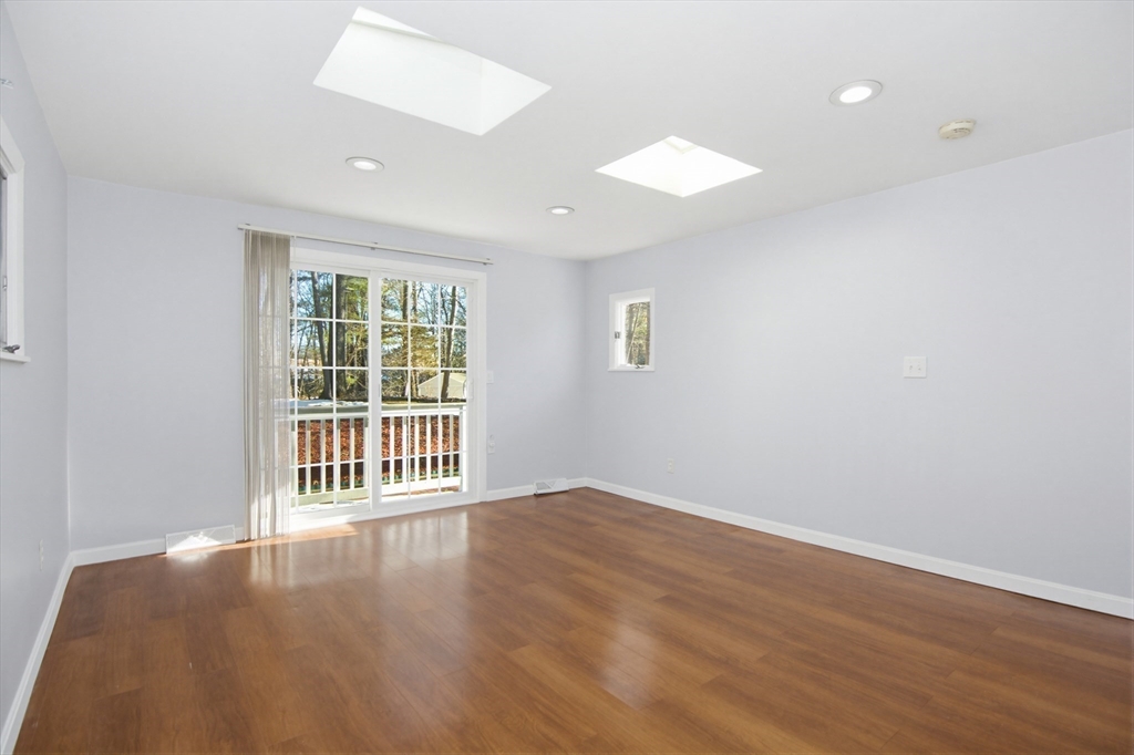 31 Spring Lane Sharon, MA 02067 - Photo 15 of 33 wooden floor in an empty room with a window