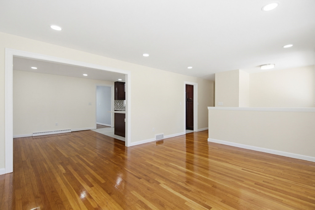 31 Spring Lane Sharon, MA 02067 - Photo 16 of 33 a view of empty room with wooden floor