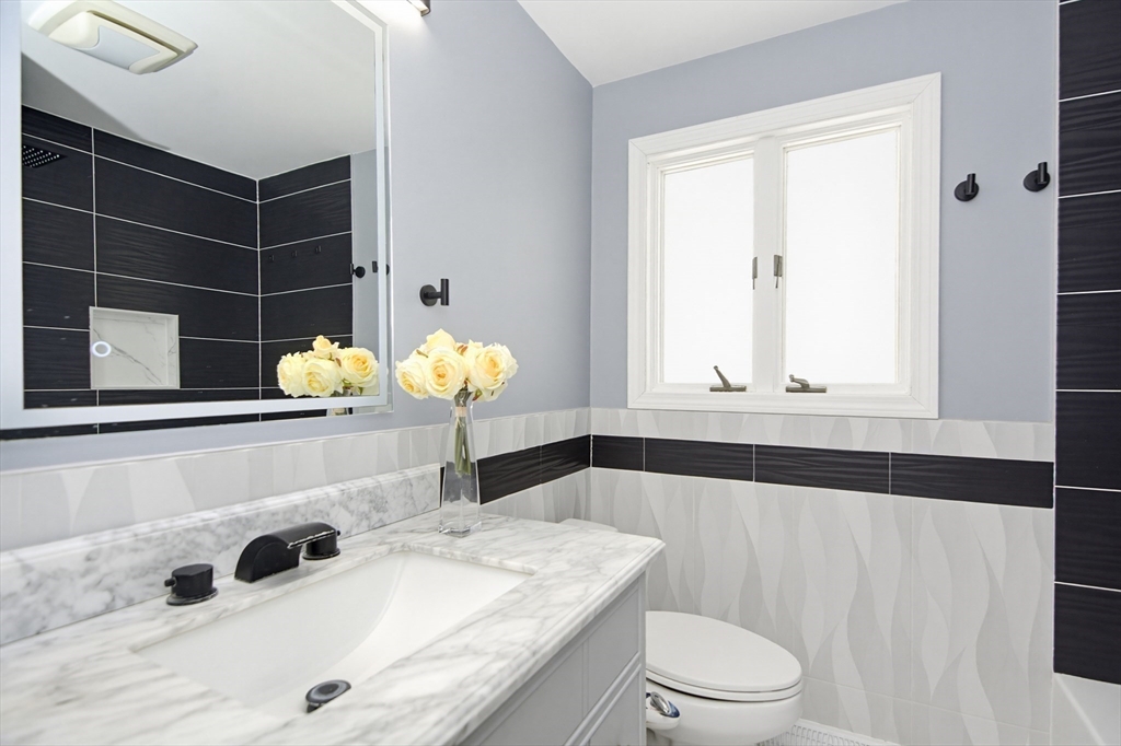 31 Spring Lane Sharon, MA 02067 - Photo 22 of 33 a bathroom with a sink a toilet and shower