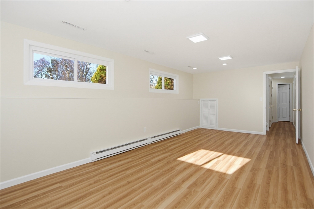 31 Spring Lane Sharon, MA 02067 - Photo 23 of 33 a view of empty room with wooden floor