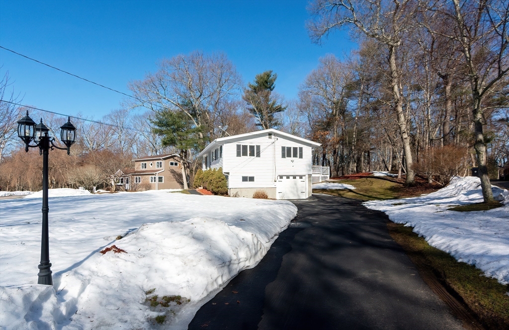 31 Spring Lane Sharon, MA 02067 - Photo 28 of 33 a view of a white house with a yard