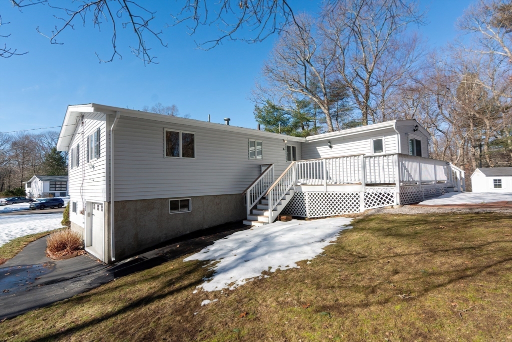 31 Spring Lane Sharon, MA 02067 - Photo 29 of 33 a view of a house with a snow in the background
