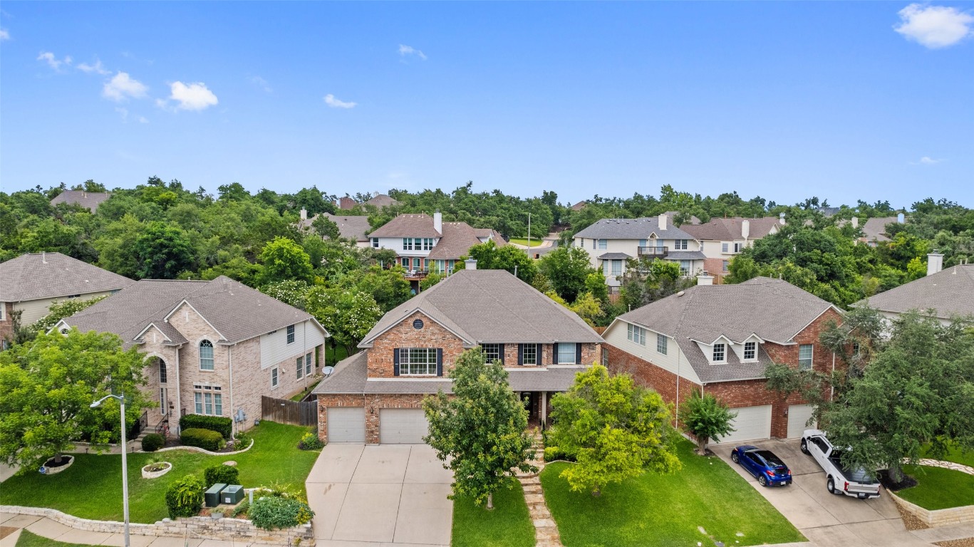 10205 Chestnut Ridge Road Austin, TX 78726 - Photo 1 of 1 an aerial view of residential houses with green space
