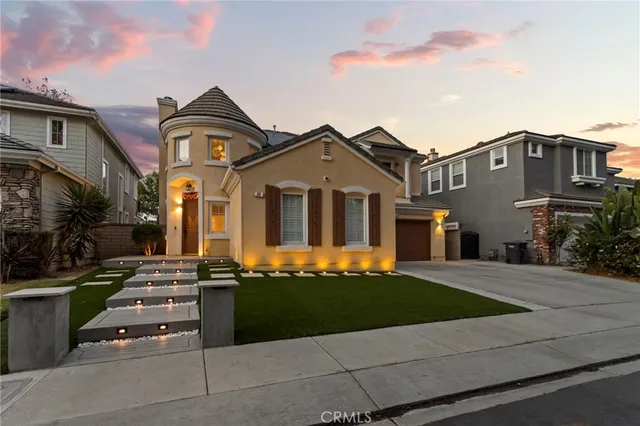 a front view of a house with a yard