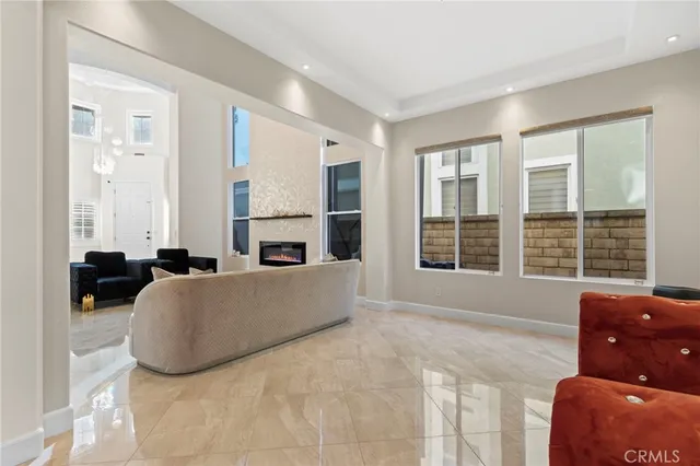 a large kitchen with stainless steel appliances kitchen island granite countertop a refrigerator and a sink