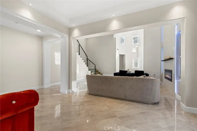 a kitchen with stainless steel appliances granite countertop a sink and a refrigerator