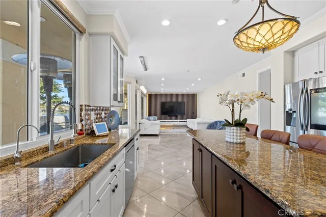 a living room with furniture and large windows