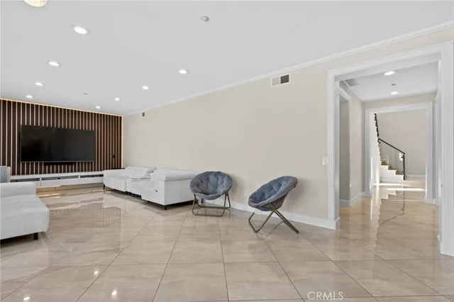 a bathroom with a granite countertop toilet a sink a mirror and a window