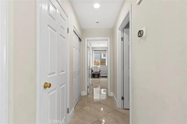 a bathroom with a granite countertop sink mirror and toilet