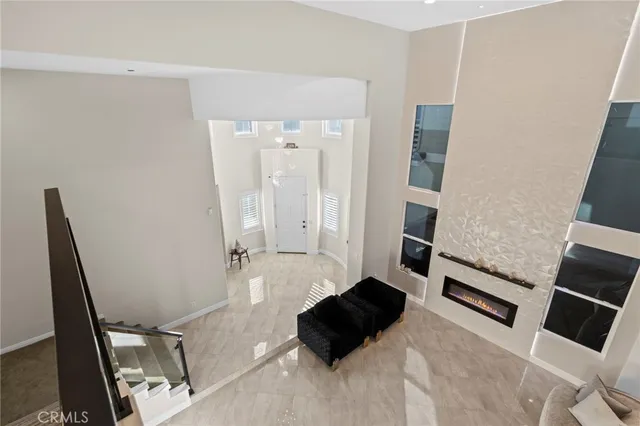 a view of a house with a chairs in patio