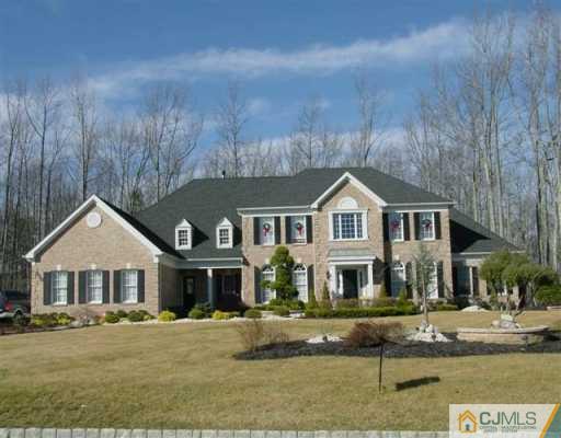 350 Brandon Boulevard Freehold, NJ 07728 - Photo 1 of 8 a front view of a house with garden