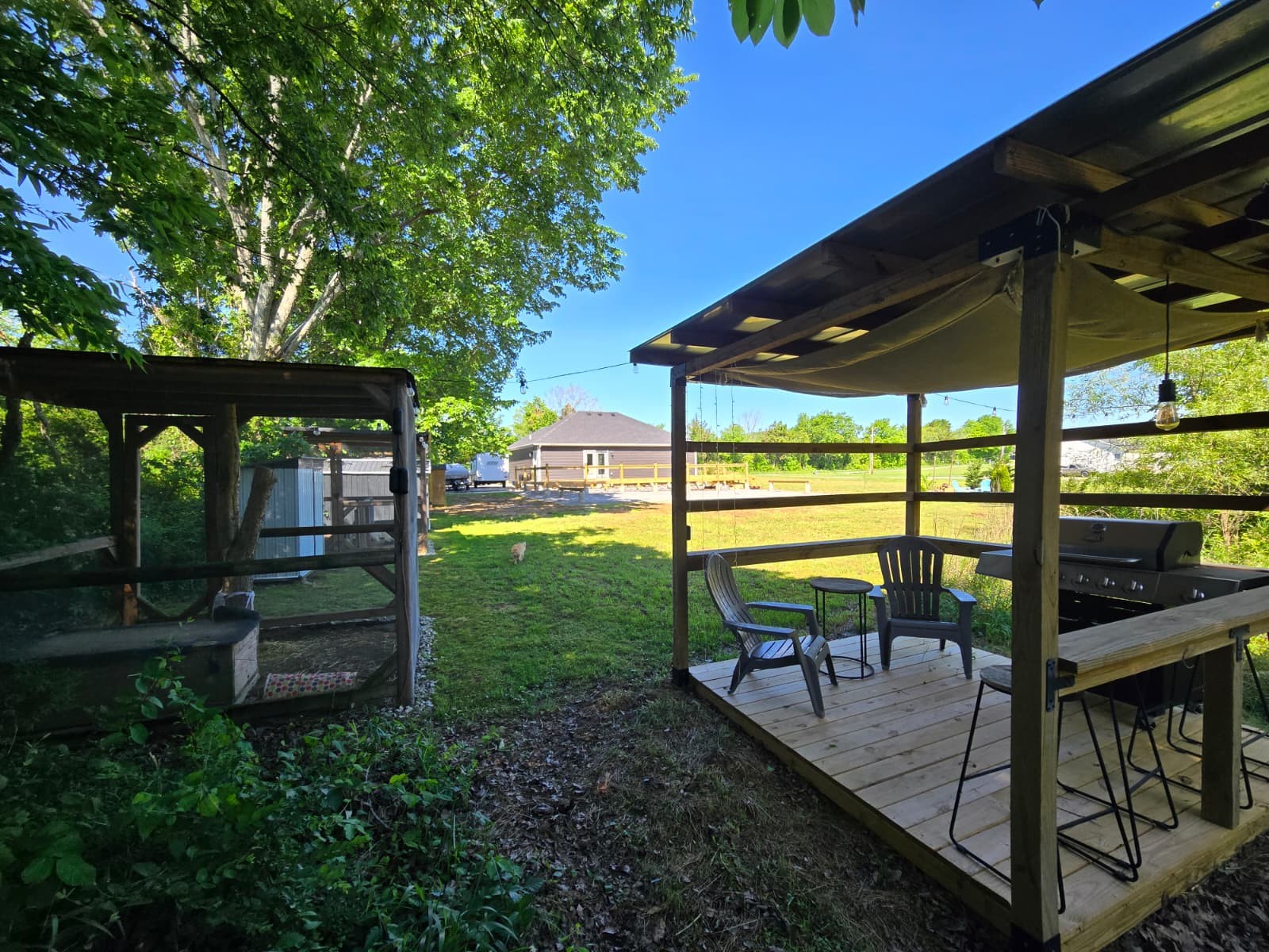 352 Scott Road Sharon Grove, KY 42280 - Photo 29 of 39 a view of a patio with table and chairs potted plants with wooden floor and fence
