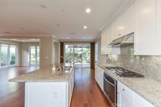 a kitchen with a stove and cabinets