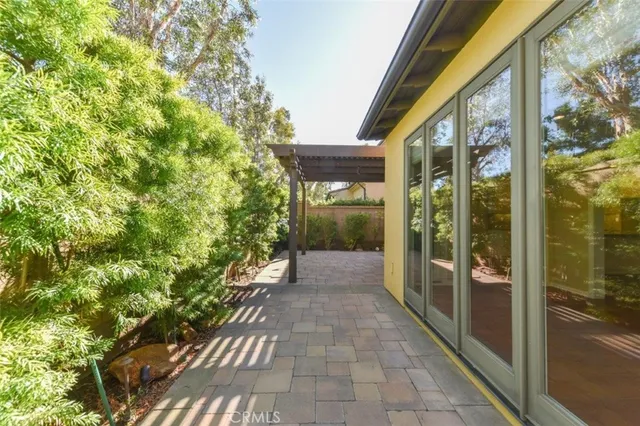 a view of a glass door with a yard