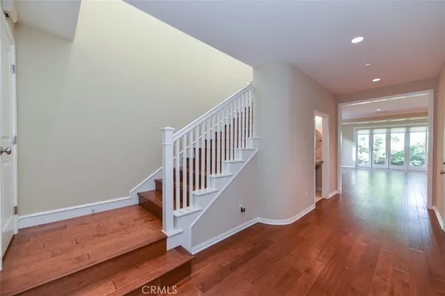 a view of entryway with wooden floor