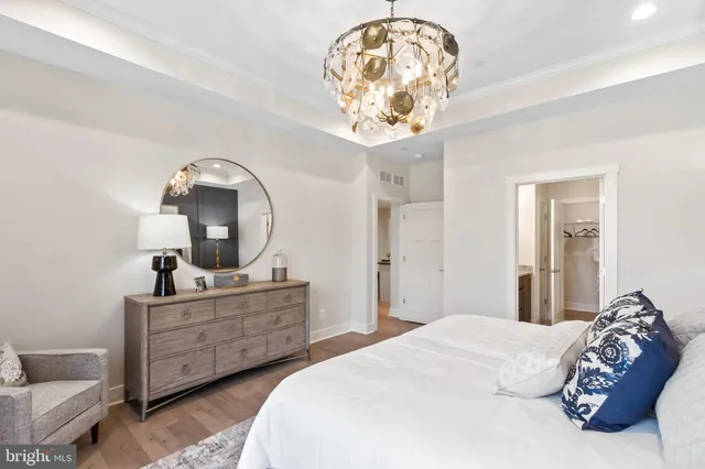 a bathroom with a granite countertop sink a mirror and a shower