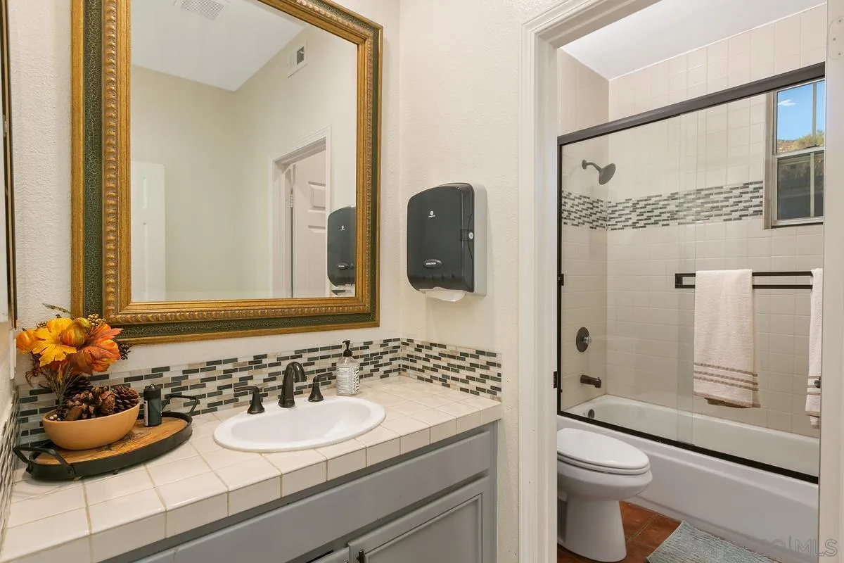 14550 Hidden Wood Road Jamul, CA 91935 - Photo 18 of 51 a bathroom with a sink toilet and shower