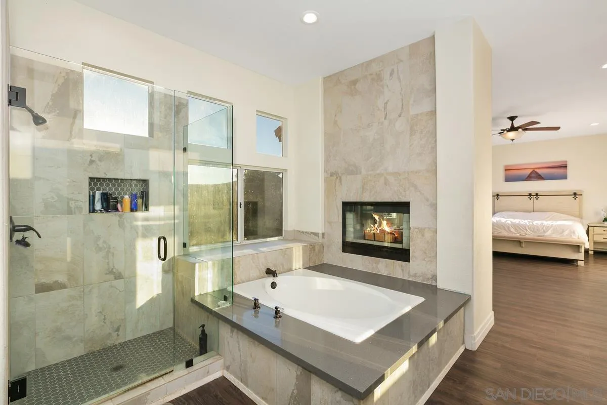 14550 Hidden Wood Road Jamul, CA 91935 - Photo 24 of 51 a bathroom with a tub sink vanity and a mirror