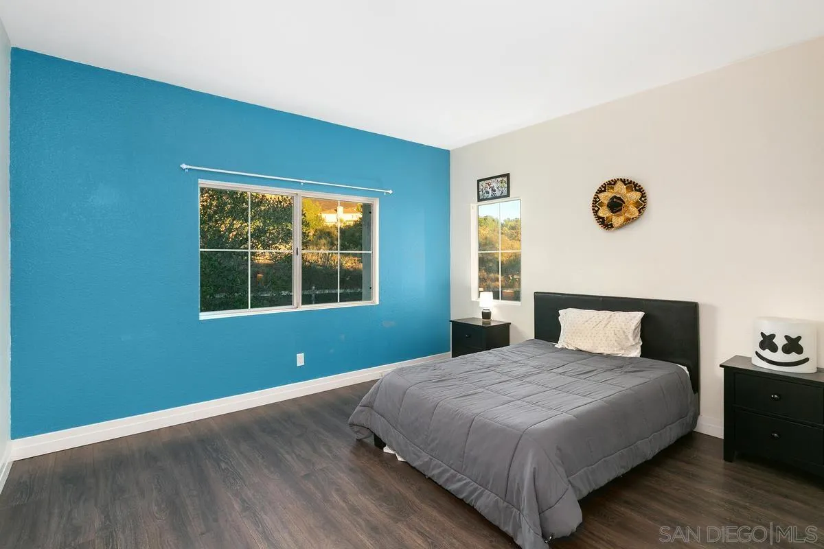 14550 Hidden Wood Road Jamul, CA 91935 - Photo 28 of 51 a bedroom with a bed and a window