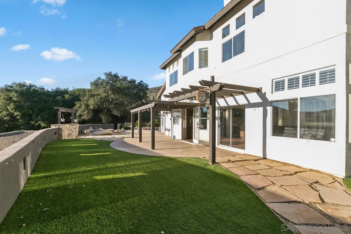 14550 Hidden Wood Road Jamul, CA 91935 - Photo 33 of 51 a view of a house with backyard and porch