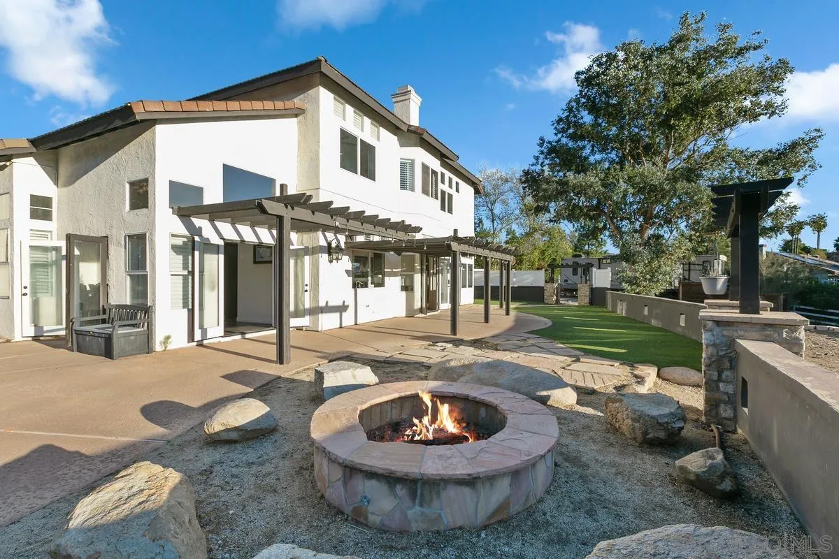 14550 Hidden Wood Road Jamul, CA 91935 - Photo 35 of 51 a front view of a house with a yard and a patio