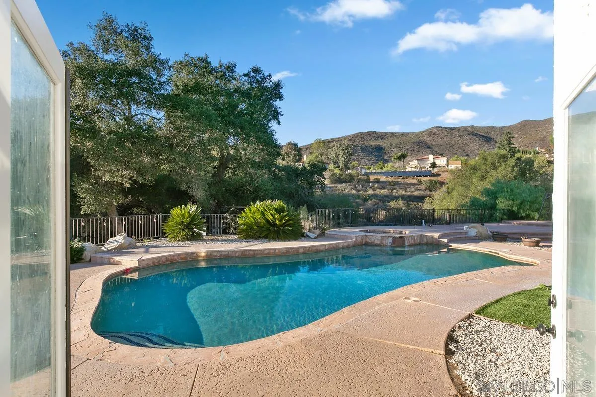 14550 Hidden Wood Road Jamul, CA 91935 - Photo 36 of 51 a view of a swimming pool with a yard