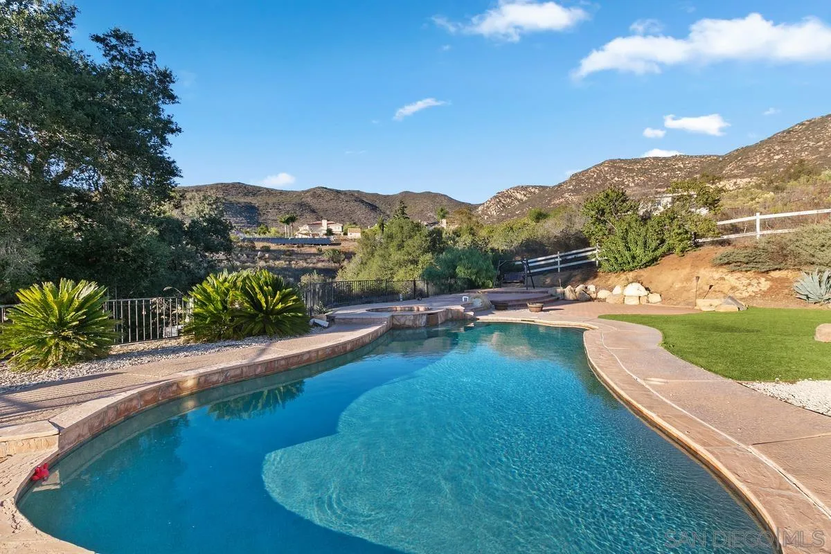 14550 Hidden Wood Road Jamul, CA 91935 - Photo 37 of 51 a view of a swimming pool with a yard