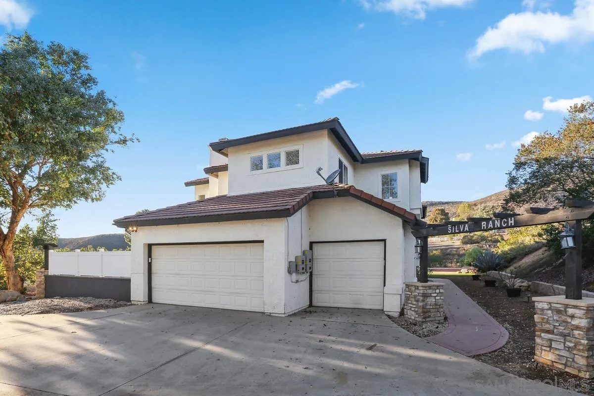 14550 Hidden Wood Road Jamul, CA 91935 - Photo 8 of 51 a front view of a house with a garage