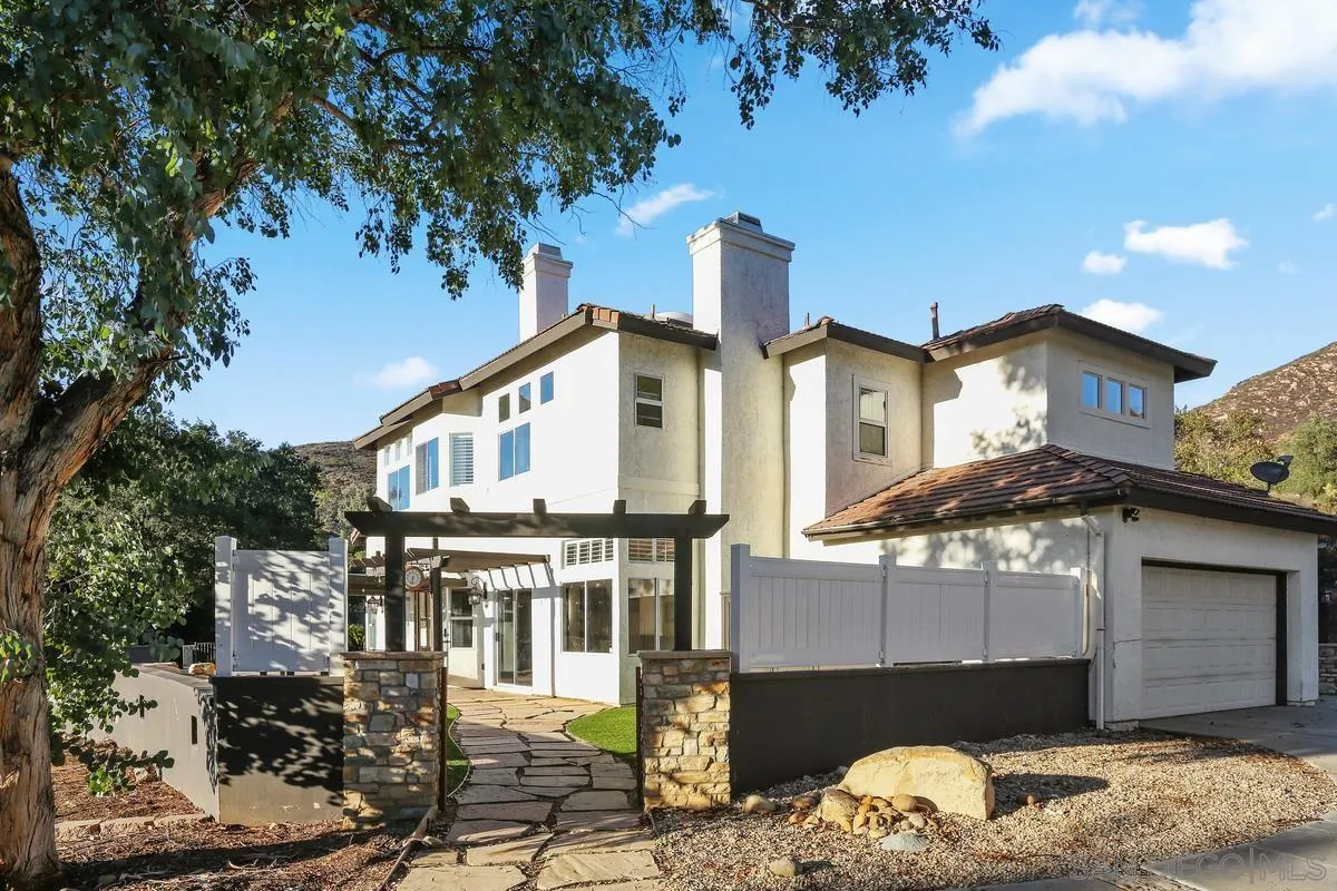 14550 Hidden Wood Road Jamul, CA 91935 - Photo 9 of 51 a front view of a house with a balcony