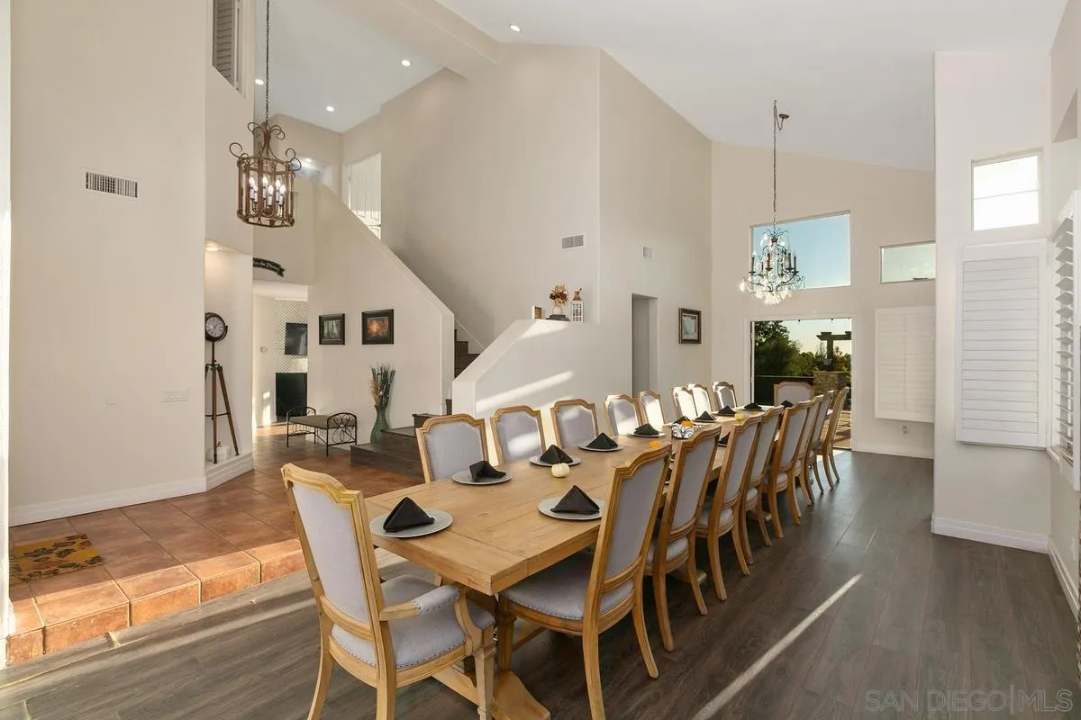 14550 Hidden Wood Road Jamul, CA 91935 - Photo 10 of 51 a view of a dining room with furniture window and wooden floor