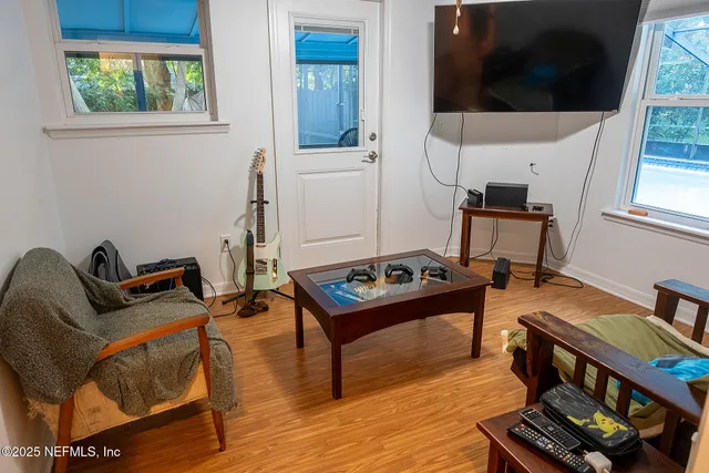 a living room with furniture and a flat screen tv