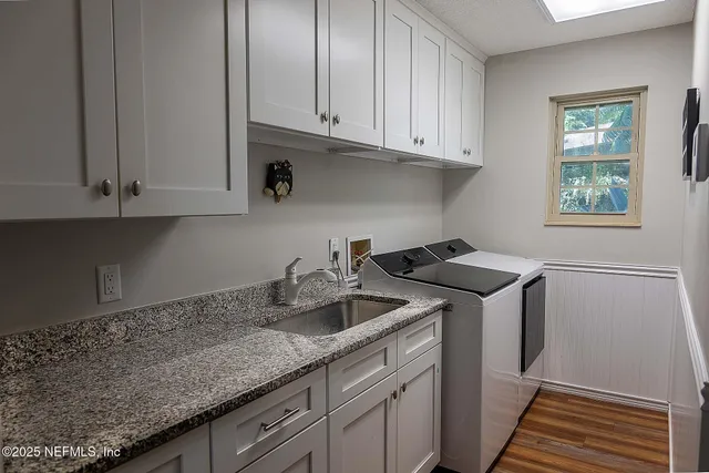 a kitchen with a sink and cabinets