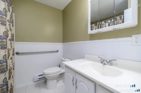 637 Cove Road, Unit A3 Stamford, CT 06902 - Photo 6 of 7 a bathroom with a sink and a toilet