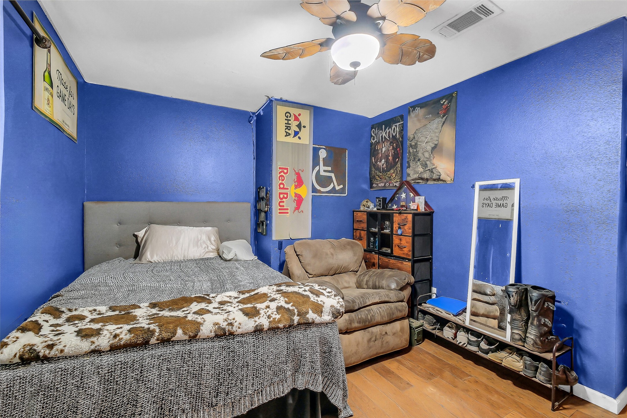 603 Hackamore Road Simonton, TX 77485 - Photo 14 of 21 a bedroom with a bed and wooden floor