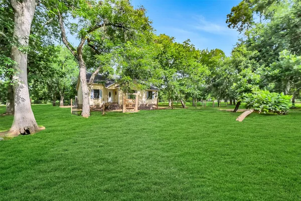 a view of a house with a big yard