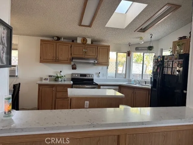 a view of a dining room with furniture and a chandelier