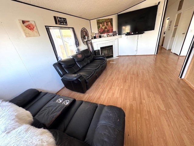 24425 Woolsey Canyon Road, Unit 196 West Hills, CA 91304 - Photo 22 of 29 a living room with furniture and a flat screen tv