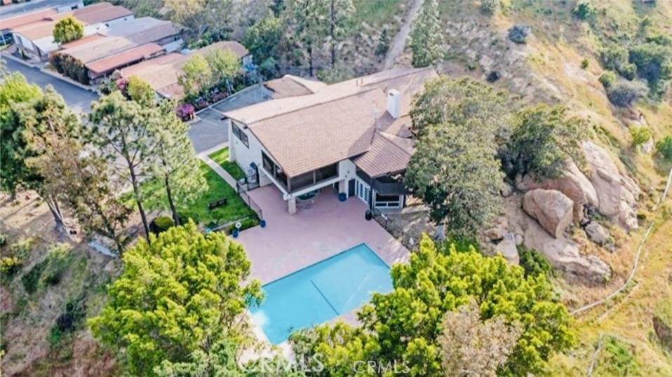 24425 Woolsey Canyon Road, Unit 196 West Hills, CA 91304 - Photo 28 of 29 an aerial view of a house with a yard and garden
